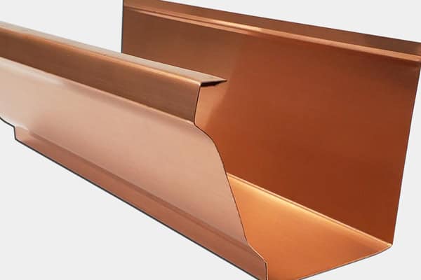 Copper gutter system for residential roofing, durable and corrosion-resistant.