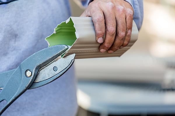 Gutter installation process with professional tools and materials.